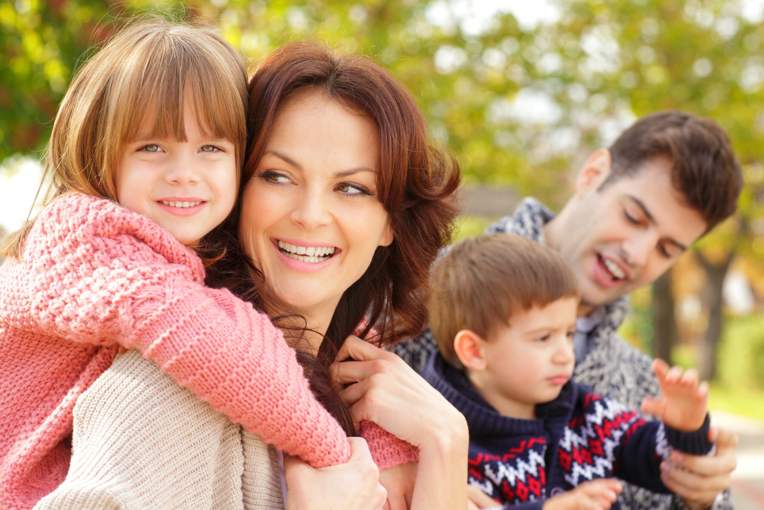 Happy parents with their children in the park